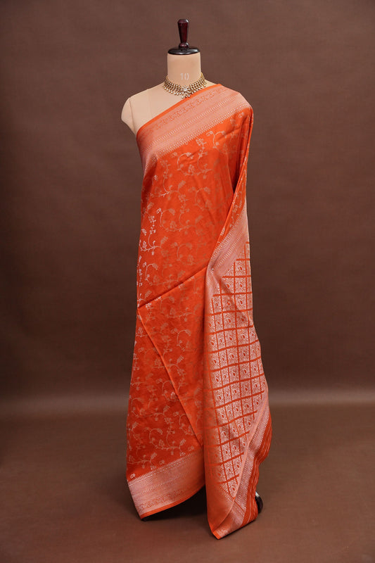 Banarasi Silk Saree β Vibrant Coral Orange with Antique Gold Zari Floral Weave