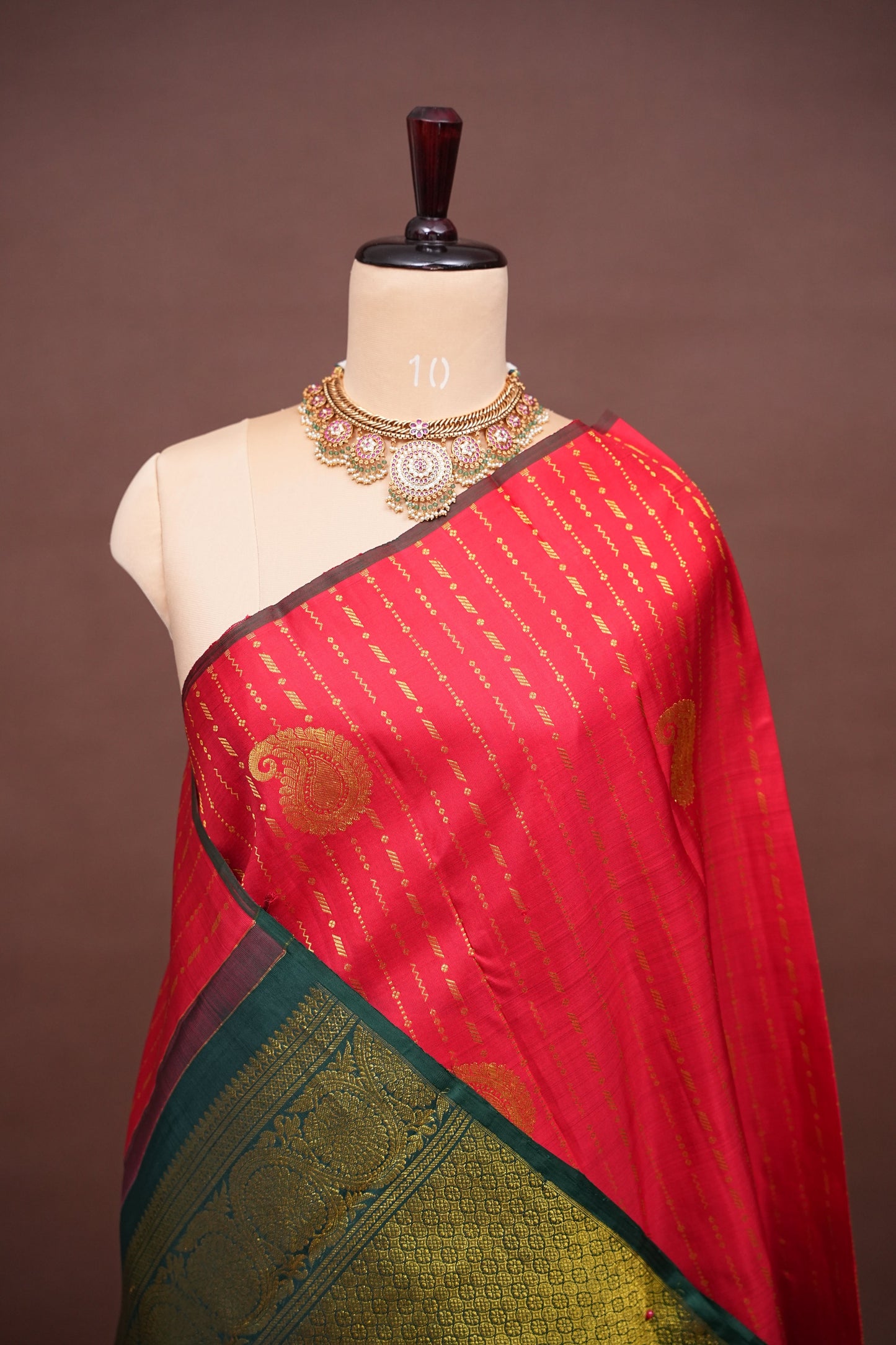 Red Borderless Pure Kanchipuram Silk Saree with Green Zari Pallu & Traditional Motifs
