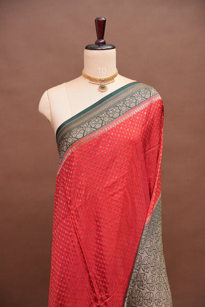 Khaddi Georgette Crepe Silk Saree with Antique Border – Red & Bottle Green