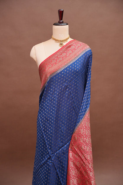 Khaddi Georgette Crepe Silk Saree with Antique Border – Peacock Blue & Red