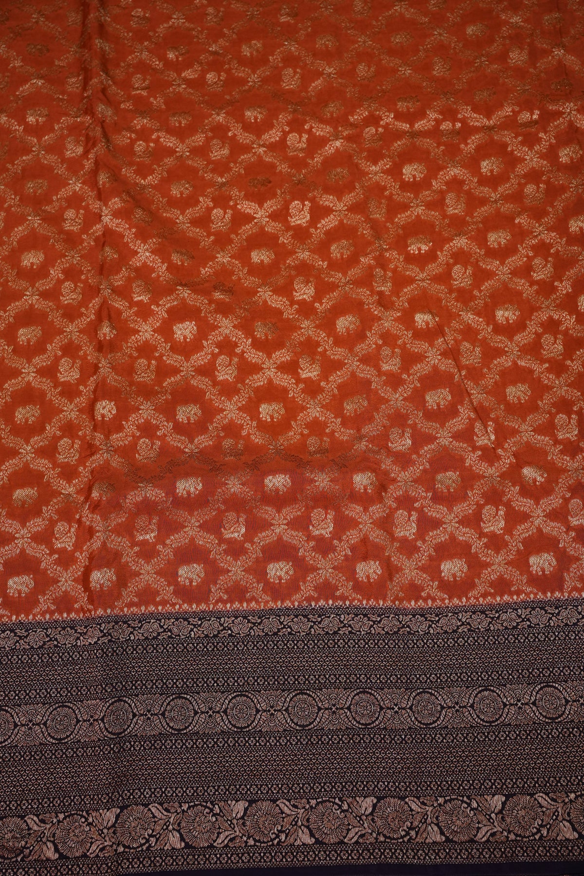 Banarasi Tussar Georgette Saree with Geometric Jaal Weave – Rust & Aubergine Purple