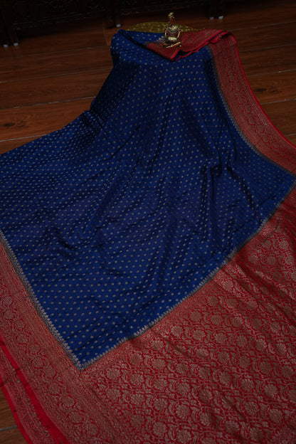Khaddi Georgette Crepe Silk Saree with Antique Border – Peacock Blue & Red