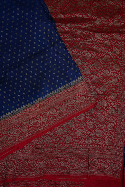 Khaddi Georgette Crepe Silk Saree with Antique Border – Peacock Blue & Red