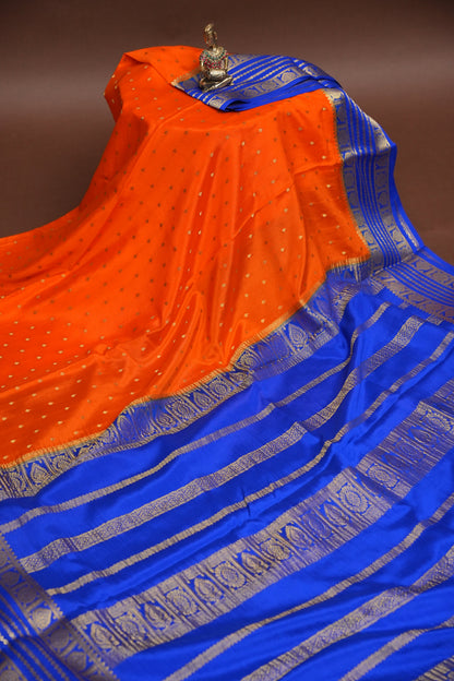Pure Crepe Mysore Silk Saree in Orange With Contrast Ink Blue Border