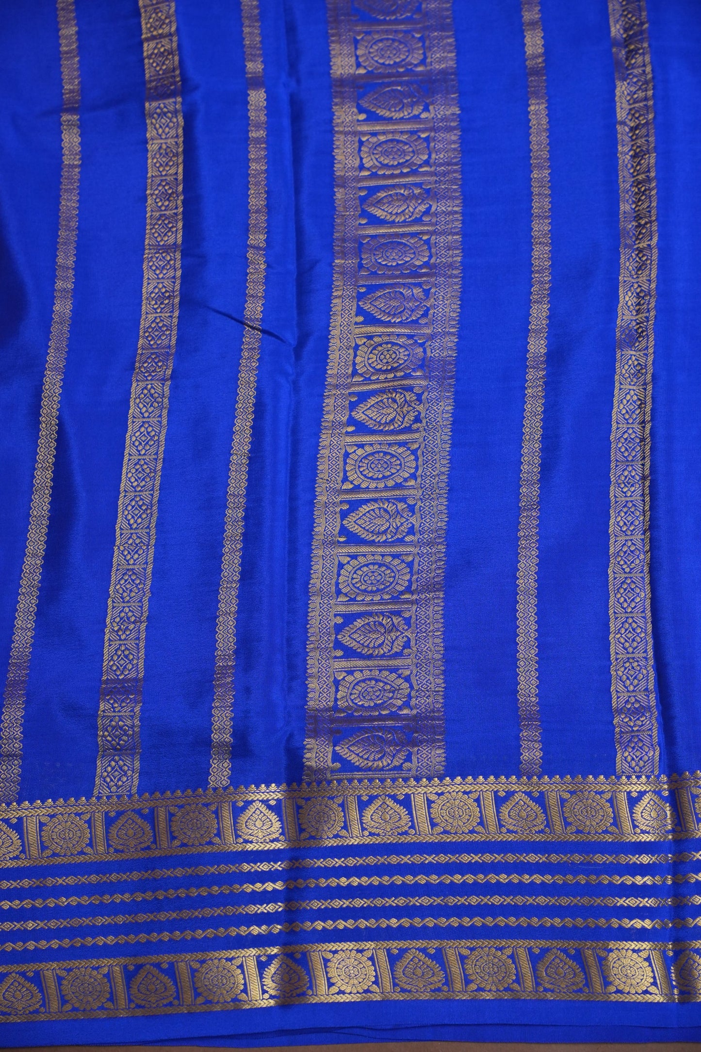 Pure Crepe Mysore Silk Saree in Orange With Contrast Ink Blue Border