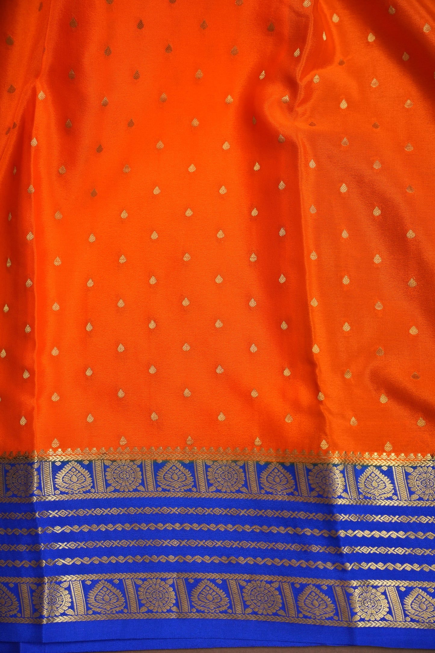 Pure Crepe Mysore Silk Saree in Orange With Contrast Ink Blue Border