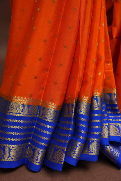 Pure Crepe Mysore Silk Saree in Orange With Contrast Ink Blue Border