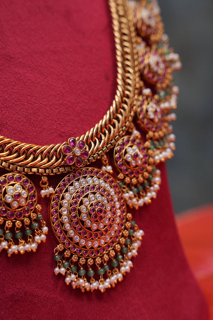 Grand Statement Antique Gold-Plated Temple Haaram Set with Ruby Stone Detailing
