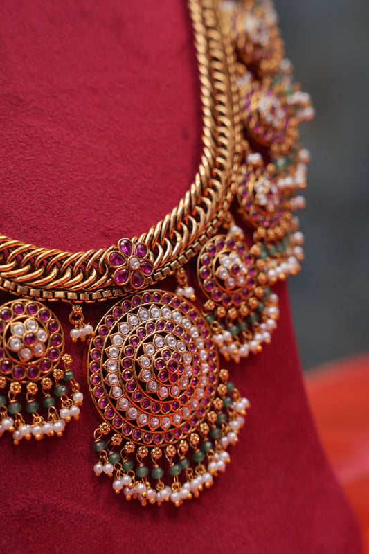 Grand Statement Antique Gold-Plated Temple Haaram Set with Ruby Stone Detailing