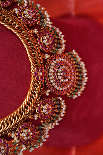 Grand Statement Antique Gold-Plated Temple Haaram Set with Ruby Stone Detailing