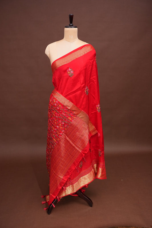 Bright Red Crepe silk saree with French knot work.