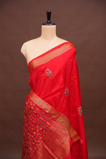 Bright Red Crepe silk saree with French knot work.